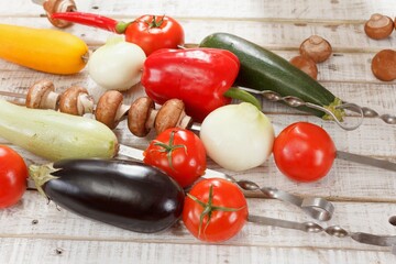 Zucchini eggplant tomato bell pepper mushrooms. summertime skewer.