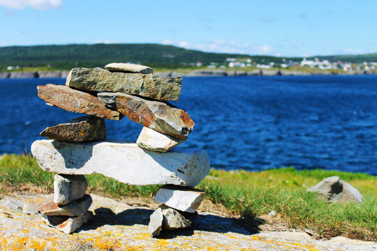 An inukshuk on a hill, overlooking the Ocean, Elliston, Newfoundland