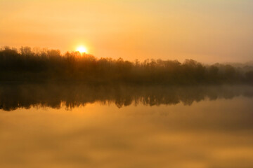 Fog at dawn. Morning fog. Foggy morning on the river. Autumn dawn. Morning fishing