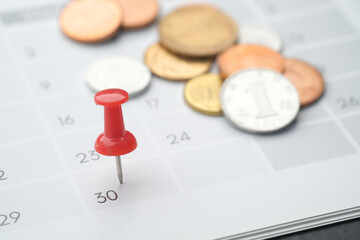 deadline concept with push pin on calendar date close up 
