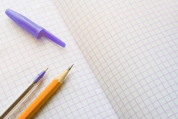education notebook with pen and pencil top view