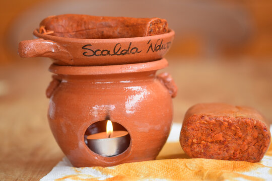 terracotta scaldanduja with two kind of nduja
