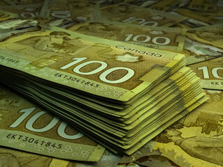 Canadian money. Canadian dollar banknotes. 100 CAD dollars bills.