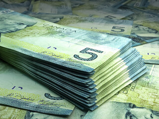 Canadian money. Canadian dollar banknotes. 5 CAD dollars bills.