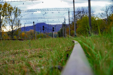 Obraz premium railroad track, glare of metal, railroad track, old sleepers , road to the distance 