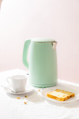Green kettle with daily breakfast