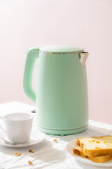 Green kettle with daily breakfast