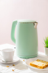 Green kettle with daily breakfast