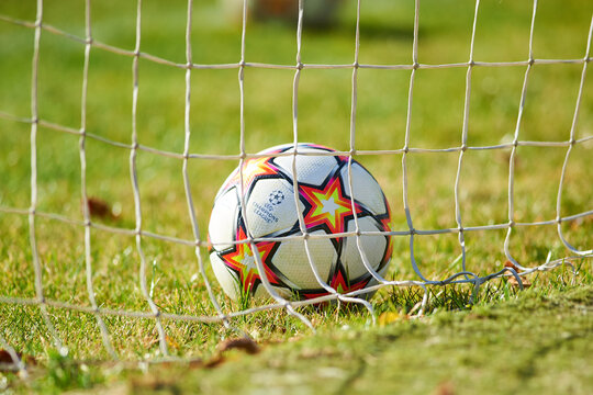 KYIV, UKRAINE - OCTOBER 27, 2020: Official UEFA Champions League match ball of the season 21/22 on the grass in football net