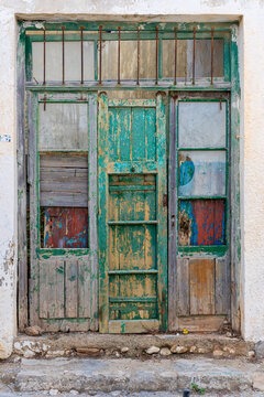 Wooden door, colorful painted in vintage style in the small village Pitsidia in the south-central of Crete. The village has kept his original character and is a popular destination of the island  
