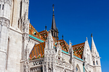 Fototapeta premium Glorious tiled roof and spires of Matyas Church, Várhegy, Budapest, Hungary