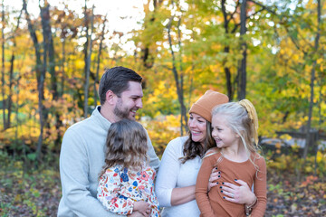 Fototapeta premium Young family outdoors in autumn