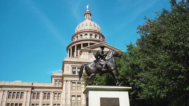 Texas Capitol Building In Downtown Austin TX With War Monument Statue In Front Of US American Flag Flying At Half Mast (4k)