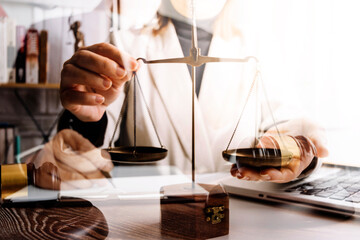 Business and lawyers discussing contract papers with brass scale on desk in office. Law, legal services, advice, justice and law concept picture with film grain effect