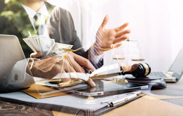 Business and lawyers discussing contract papers with brass scale on desk in office. Law, legal services, advice, justice and law concept