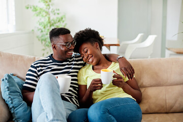 woman couple man happy happiness  love black young lifestyle together romantic boyfriend girlfriend laughing hug coffee tea cup mug