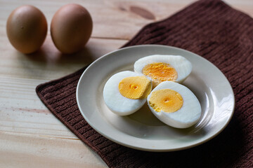boiled eggs in  plate.It full of protein and cholesterol.