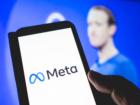Meta, new name for Facebook Inc - American digital company, owner of Facebook, Instagram, Oculus VR - background with blurred image of Mark Zuckerberg
