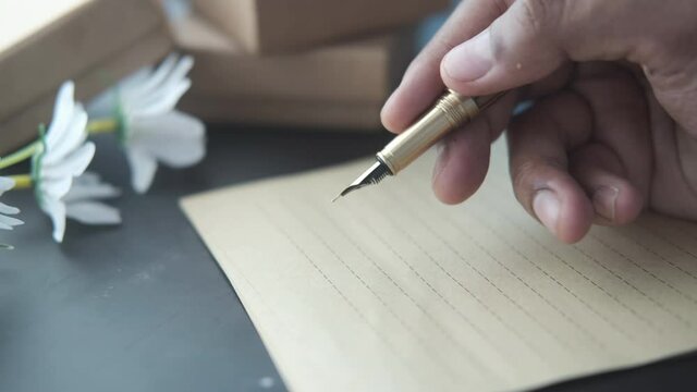 writing with a fountain pen on paper 
