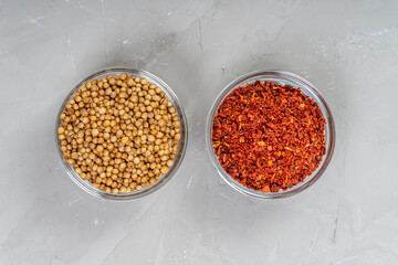 Set of various spices on black cutting board