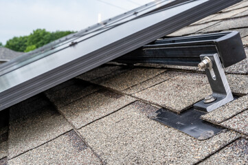 Rail, bracket, and anchor to a solar panel installed on a asphalt shingle roof