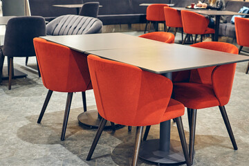 Restaurant and Cafe interior modern style design. Decorative plants palms in a pot, neon sign