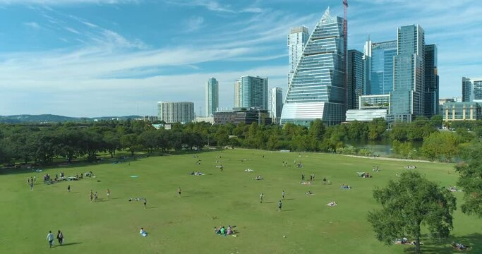 Auditorium Shores at Town Lake Dog Park and View of Colorado River and Downtown Austin Texas Skyline (Aerial Drone View in 4k)
