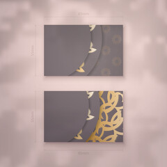 Brown business card with abstract gold ornament for your brand.