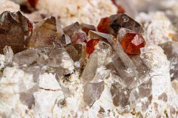 Macro mineral stone Spessartine, Feldspar, Smoky quartz, on a white background