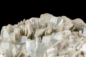 Macro mineral stone Aquamarine in rock on a black background