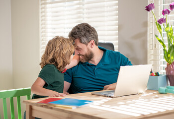 homeschooling and elearning. back to school. happy father and son use communication technology