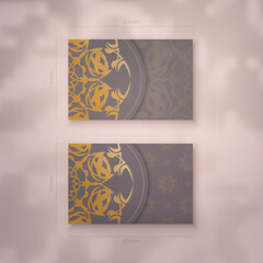 Presentable business card in brown color with abstract gold pattern for your brand.