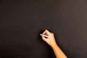 Naklejka premium hand writing on a blackboard