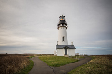 Yaquina Head Outstanding Natural Area against a cloudy sky in Newport, USA