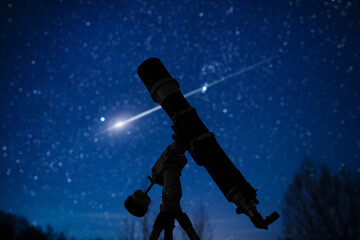 Silhouette of telescope and countryside under the starry skies.