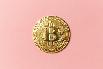 The gold coin of bitcoin on pink background. Online payment technology, digital wallet, computer financial, cryptocurrency trading and investment concept. The concept of blockchain and mining