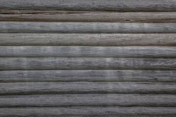Obraz premium Lines of Wooden Cracked Logs Background Wood Texture Of Cabin Wall