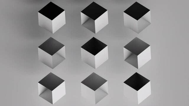 Synchronized rotation of empty cubes on gray background. 3d pattern animation.