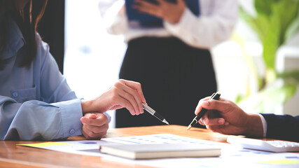 Team work with business analytic price chart on the table at the conference room.