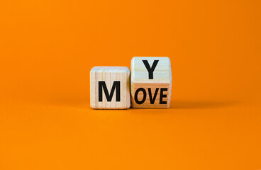 Make my move symbol. Turned a wooden cube with words 'My move'. Beautiful orange background. Make my move and business concept. Copy space.