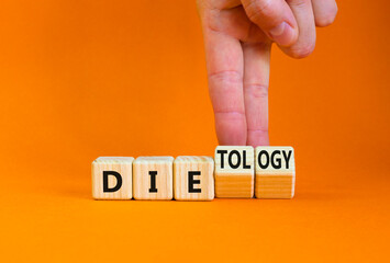 Dietology instead die symbol. Doctor turns wooden cubes and changes the word die to dietology. Beautiful orange table, orange background. Healthy lifestyle, dietology instead die concept. Copy space.