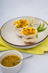 passion fruit dessert with a yellow cloth on a marble background
