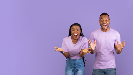 Portrait of excited young black couple hearing great news, banner