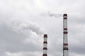 Smoke is emitted from the production chimneys, polluting the air.