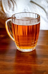 Beer mug with beer close-up on the table