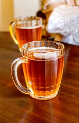 Beer mug with beer close-up on the table