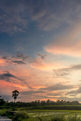 A beautiful sunset afternoon landscape with bright orange clouds