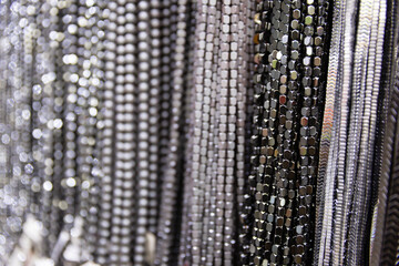 Close up shot of metal beads in different colors and patterns