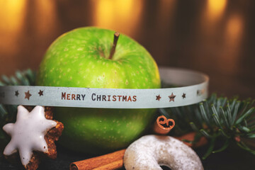 green Apple with Candle lights in Background - Banderole merry Christmas