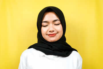 Closeup of beautiful young muslim woman enjoying, relaxing, peaceful, isolated